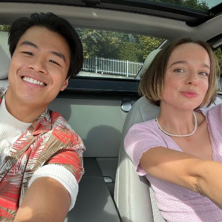 Emily Haine and Wern Lee taking the selfie in the car.